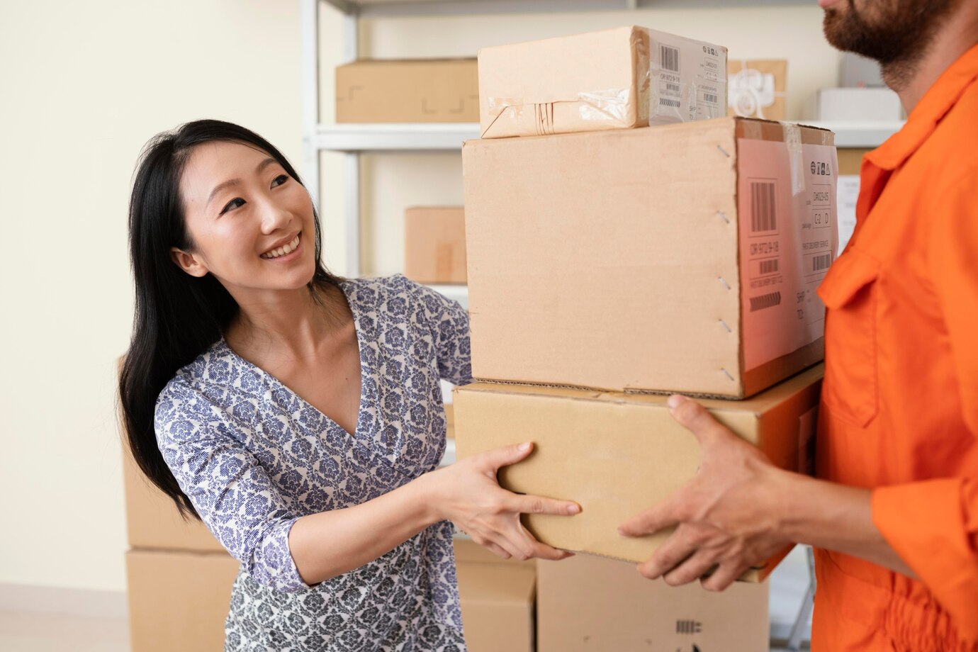 smiling-young-woman-handing-delivery-boxes-courier_23-2148944564